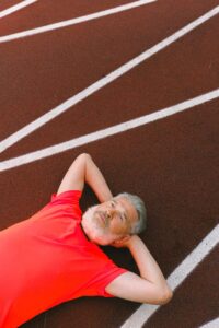 man resting on a race track